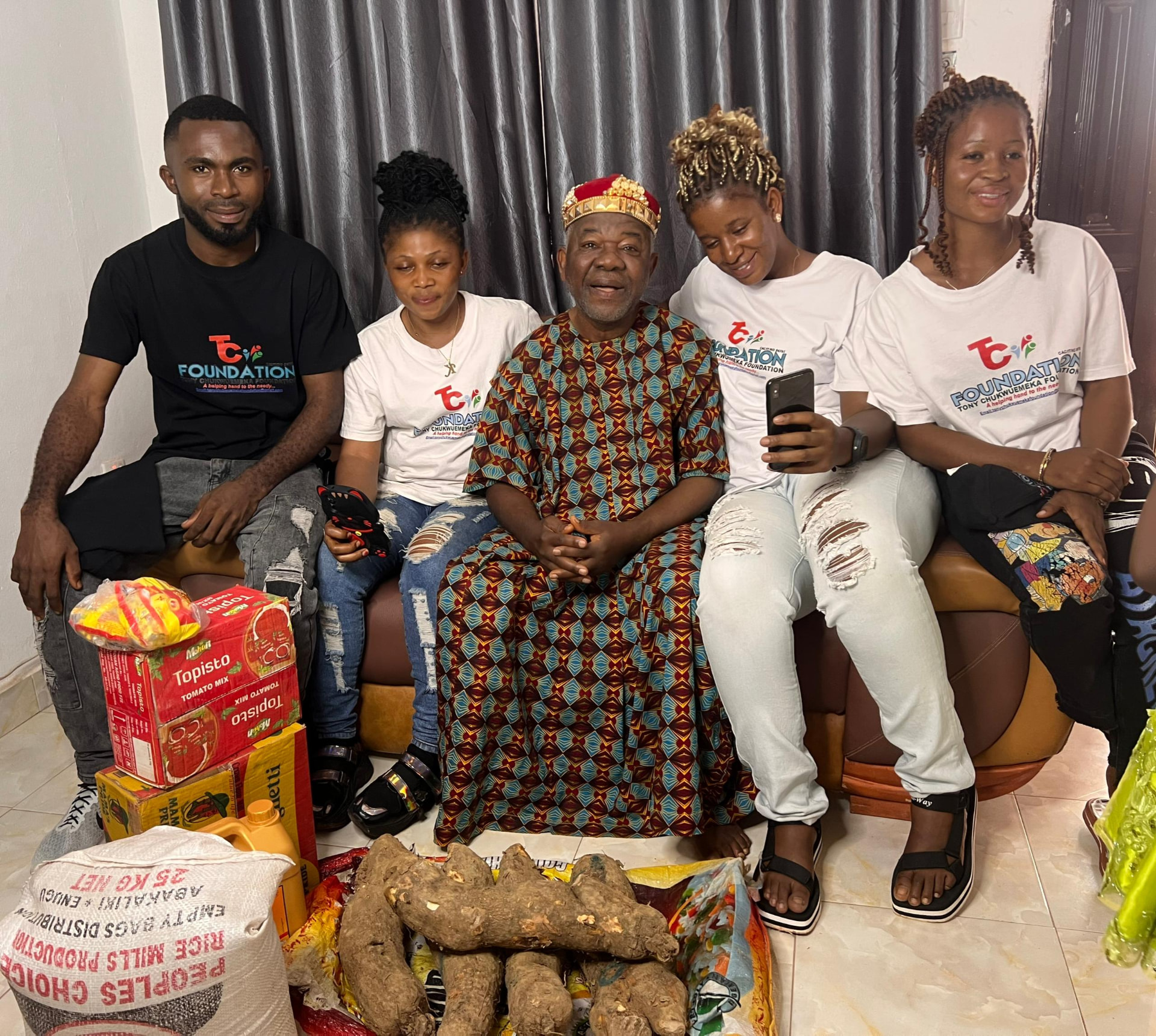 Rice, yams and provisions presented during a community visit.